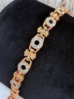 Vintage aged goldtone Circle and Bow Link Bracelet